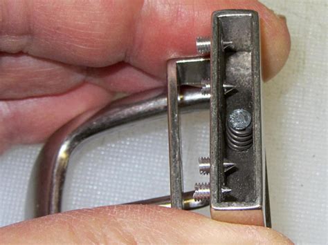 reversible belt buckle spring repair